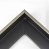 This Medium, L-shaped floating contemporary canvas frame in matte black features a thin brushed Silver face.    *Note: These solid wood, custom canvas floaters are for stretched canvas prints and paintings, and raised wood panels.