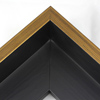 This Large, L-shaped floating contemporary canvas frame in matte black features a thin brushed gold face.    *Note: These solid wood, custom canvas floaters are for stretched canvas prints and paintings, and raised wood panels.