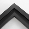 This simplistic yet modular matte black frame is designed for metal prints, acrylic prints and dry mounts. This smart design features a minimalist stepped profile that serves as a floater frame or a standard picture frame.    For the floating effect, the print can be attached on top of the inner step of the frame, without sacrificing the artwork edges.    This frame can also be used as standard picture frame. The lowered center paired with slightly raised outer lip creates a frame within a frame effect. However, due to the inner most lip of the frame, a fraction of the artwork will be hidden. But, this can be avoided with a linen liner combo.