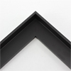 This small, L-shaped floating canvas frame in matte black features a simple flat face.    *Note: These solid wood, custom canvas floaters are for stretched canvas prints and paintings, and raised wood panels.